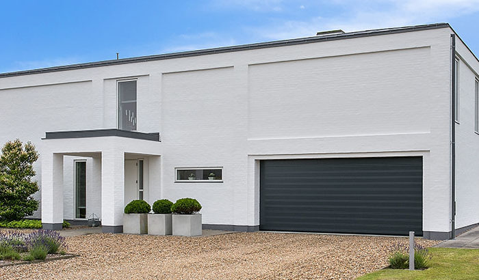 Wide black garage door header